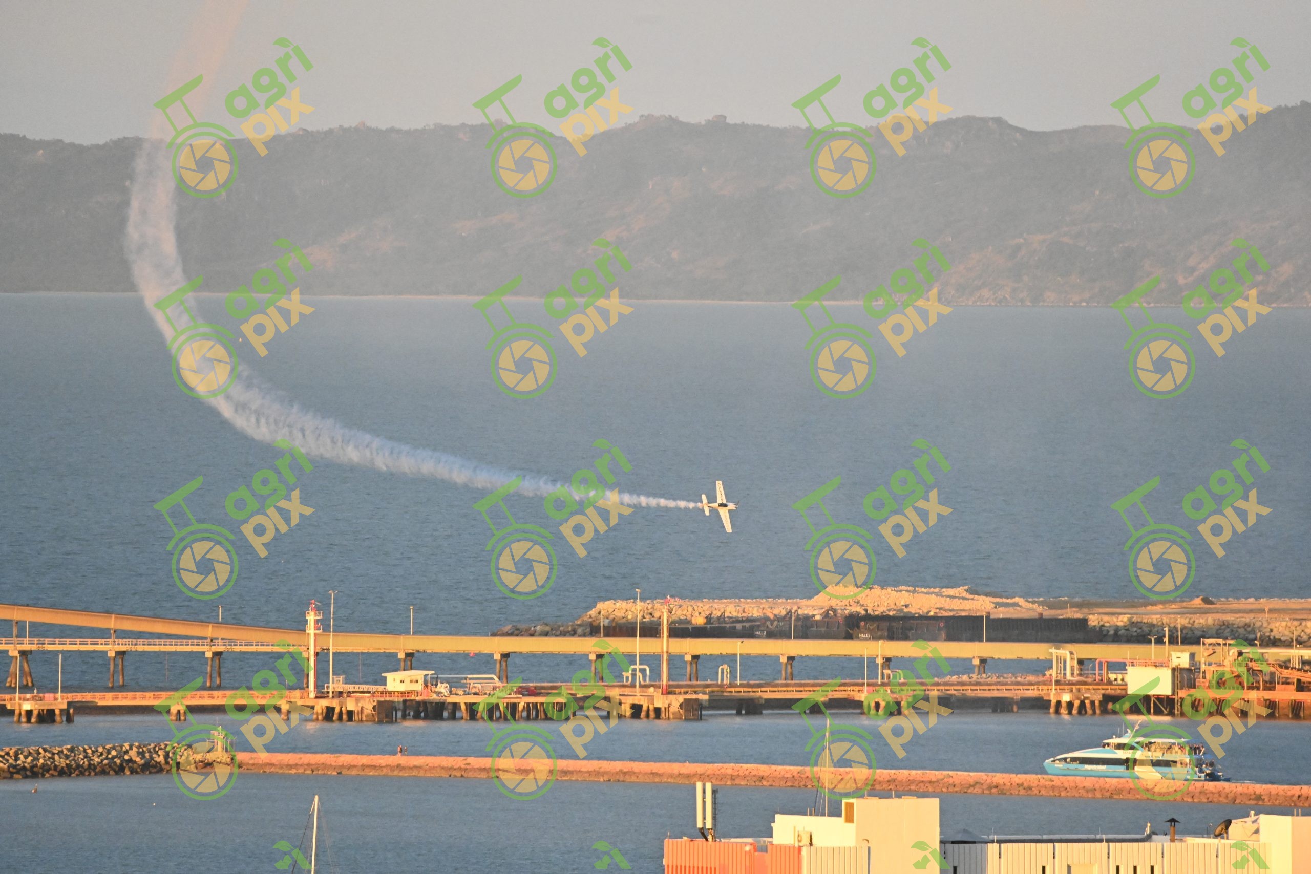 Stunt Aircraft Performing Above the Port of Townsville During the 2024 Townsville Airshow